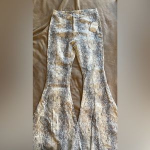 Snakeskin print flares from Altar’d State. Brand new with tags!